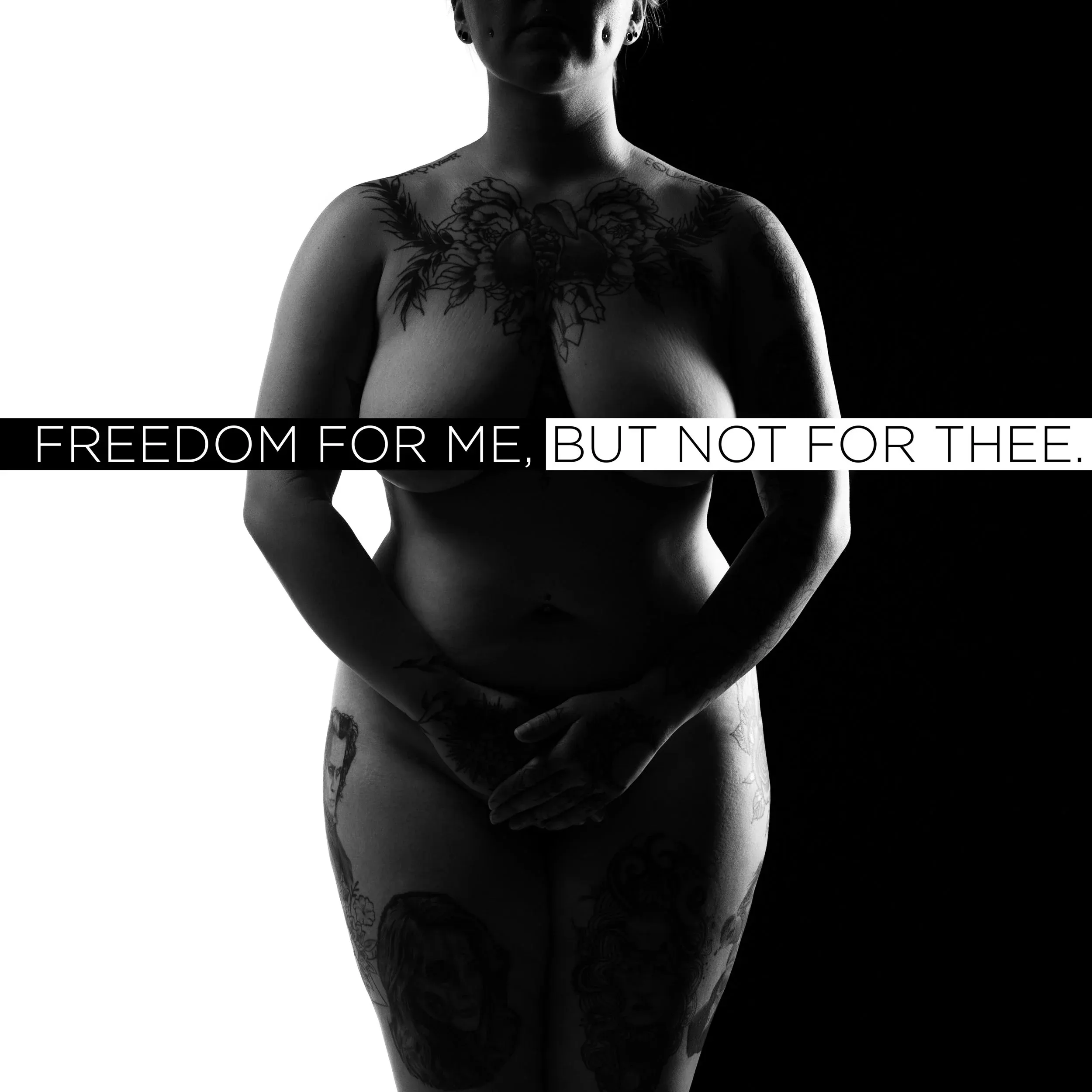 A backlit figure stands beneath the words “Freedom for Me, but Not for Thee.”
